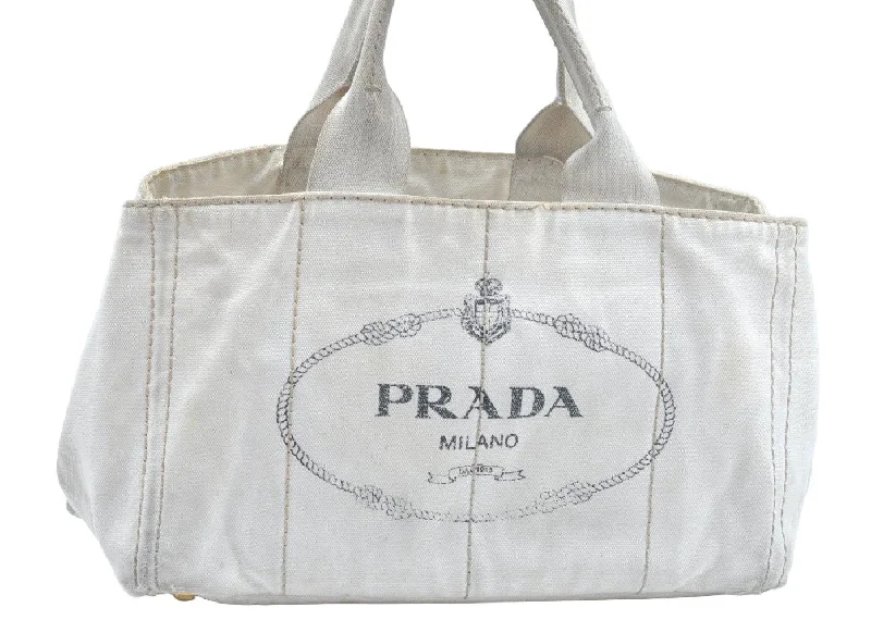 Prada Cleo bags with a contrast - colored interior for visual interestAuthentic PRADA Canapa M Vintage Canvas Tote Hand Bag White L0090