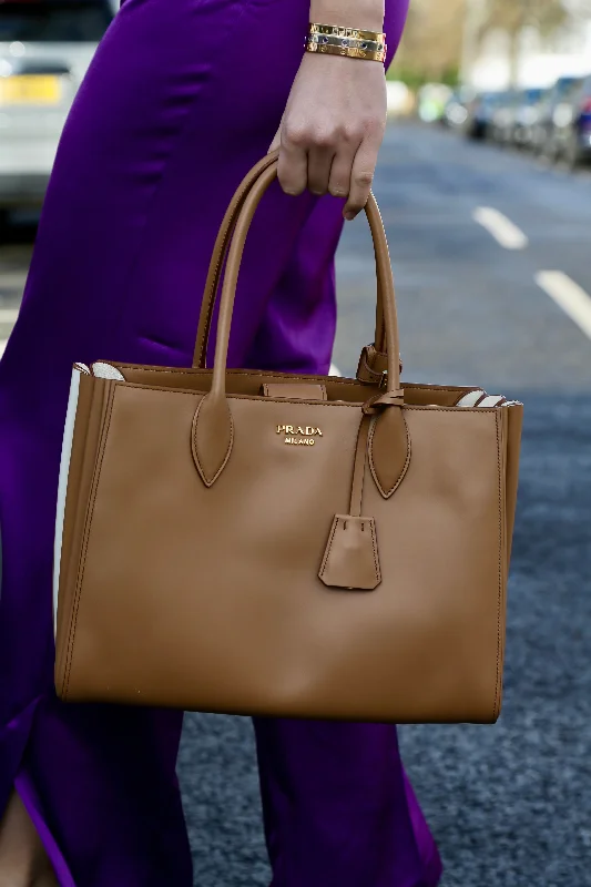 Prada Cleo bags with a detachable coin purse for added functionalityPRADA City Calf Caramel Handbag